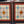 Load image into Gallery viewer, Pair of Multicolored Rondel Stained Glass Windows in Cambria Ash Frames GA9370