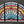 Load image into Gallery viewer, Arched Textured Stained Glass Window in Wood Frame 40" Tall by 70" Long GA9737