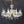Load image into Gallery viewer, 8 Light Chandelier with Canopy Top Brass Trim & Crystal Flower Prisms GS00426