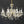 Load image into Gallery viewer, 8 Light Chandelier with Canopy Top Brass Trim & Crystal Flower Prisms GS00426