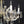 Load image into Gallery viewer, 8 Light Chandelier with Canopy Top Brass Trim & Crystal Flower Prisms GS00426