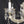 Load image into Gallery viewer, 8 Light Chandelier with Canopy Top Brass Trim & Crystal Flower Prisms GS00426