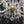 Load image into Gallery viewer, 8 Light Chandelier with Canopy Top Brass Trim & Crystal Flower Prisms GS00426