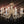 Load image into Gallery viewer, 8 Light Chandelier with Canopy Top Brass Trim & Crystal Flower Prisms GS00426