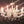 Load image into Gallery viewer, 8 Light Chandelier with Canopy Top Brass Trim & Crystal Flower Prisms GS00426