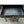 Load image into Gallery viewer, 1920's Steel Medical Cabinet with White Ultralight Glass Top on Wheels GA9361