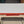 Load image into Gallery viewer, Mid Century Modern White & Red Porcelain Top Draw Table #GA9116
