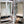 Load image into Gallery viewer, Pair of Steel Medical Cabinets with Beveled & Wavy Glass on Cabriole Legs #GA2190