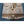 Load image into Gallery viewer, 1909 Cast Iron Paper Mailbox with Embossed Scroll Designs #GA1909
