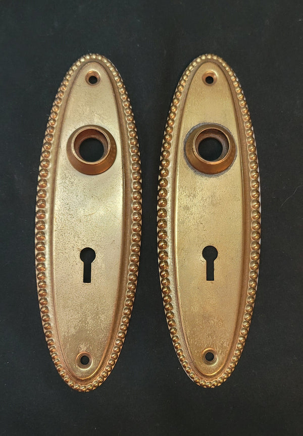 Pair of Oval Door Knob Back Plates with Beaded Trim 7" x 2 1/4" GS00586A