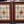Load image into Gallery viewer, Pair of Multicolored Rondel Stained Glass Windows in Cambria Ash Frames GA9370
