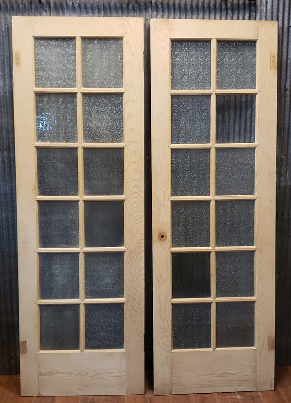 Pair of Newly Stripped Textured Glass Interior Doors 27 1/4" x 81 1/2" GA9562