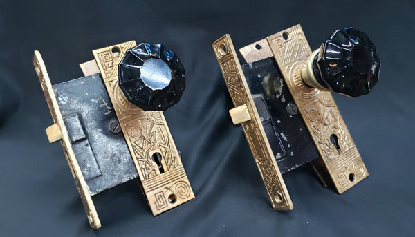 Restored Pair of Eastlake Mortice Lock Sets in Red Brass w/ 12 Point Black Glass Knobs GS00226