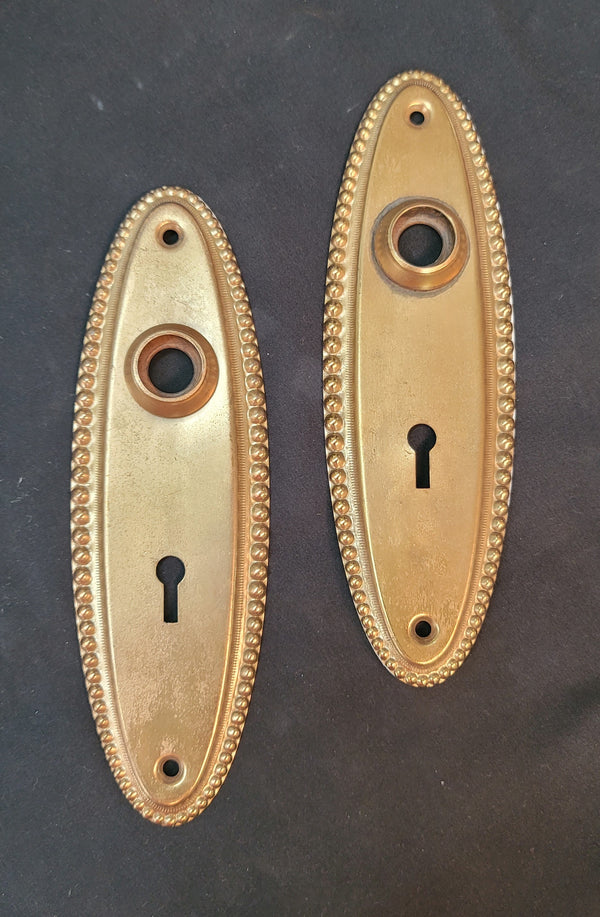 Pair of Oval Door Knob Back Plates with Beaded Trim 7" x 2 1/4" GS00586A